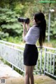 A woman taking a picture of herself with a camera.