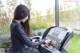 A woman is running on a treadmill in a gym.