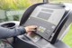 A person is using a tread machine in a gym.